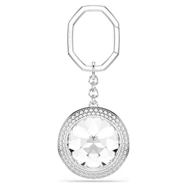 Detail shot of the Swarovski swan logo engraved on the back plate of the rhodium plated bag charm hardware
